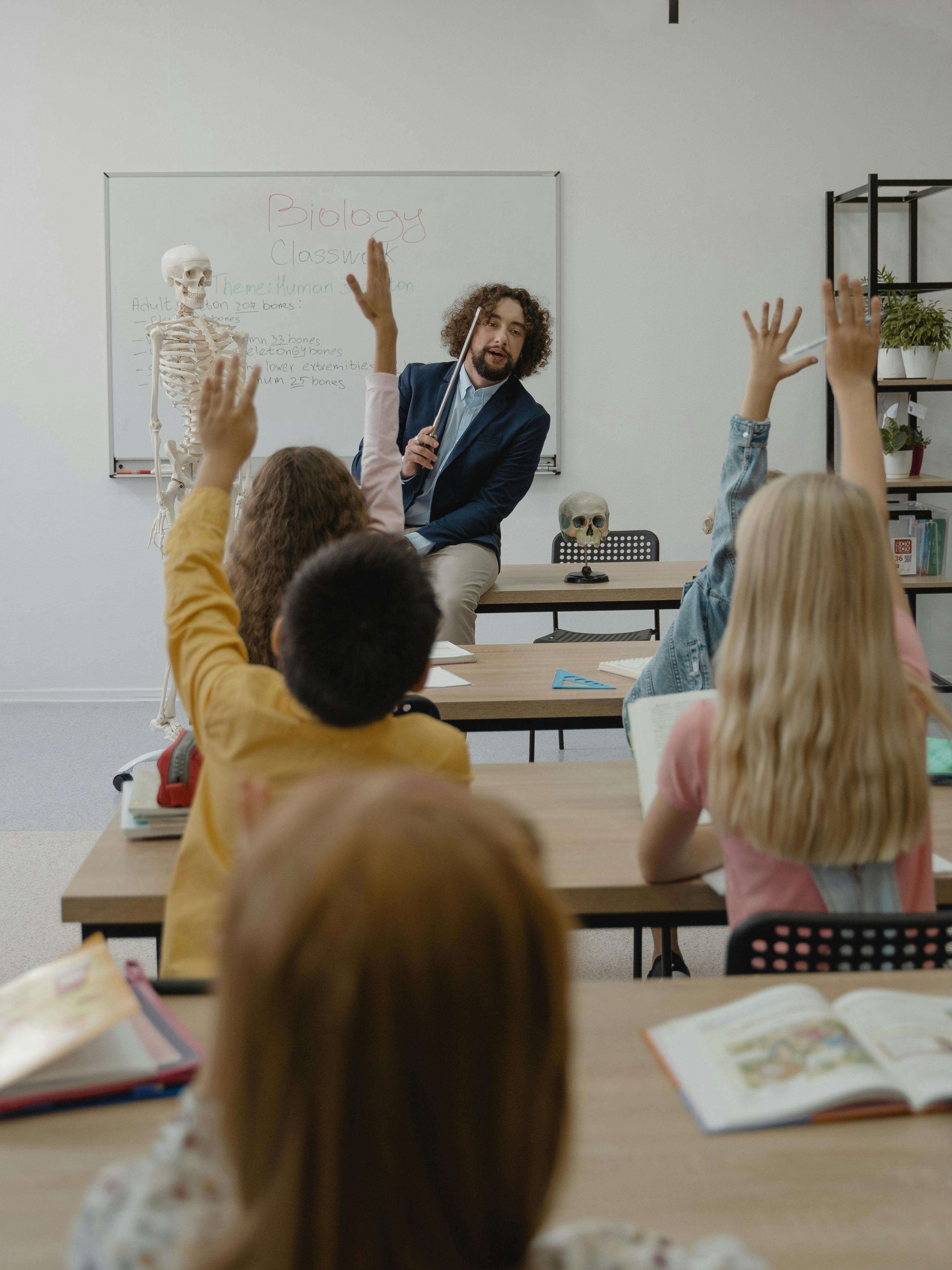 Teacher delivering a science lesson with pupils actively participating in class